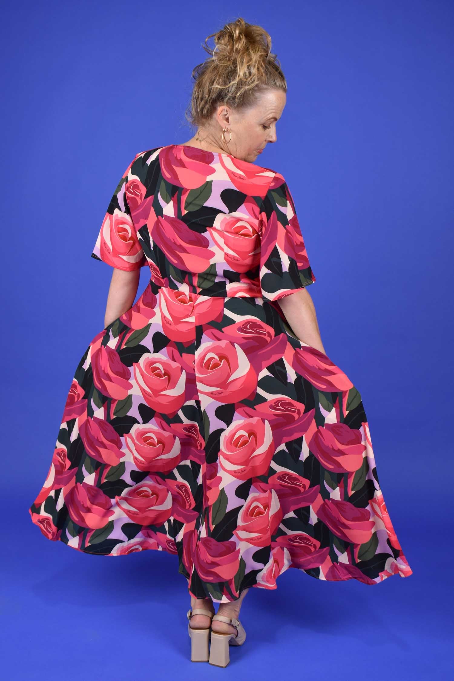 Floral occasion dress with pockets by Annah Stretton