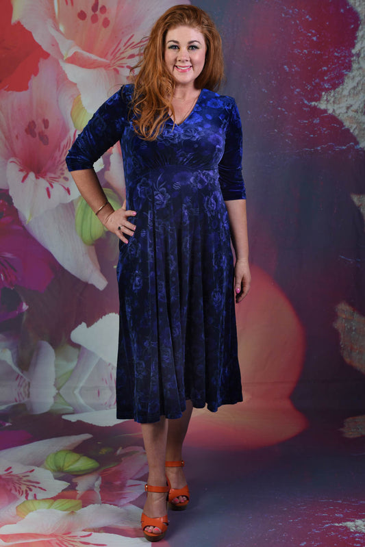 Model wearing the Annah Stretton Veronica Jude Dress in blue floral spot