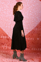 model wearing winter rose black spot dress