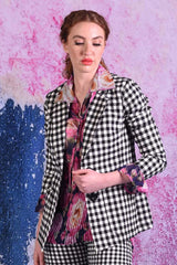 model wearing winn check jacket with posy floral top.