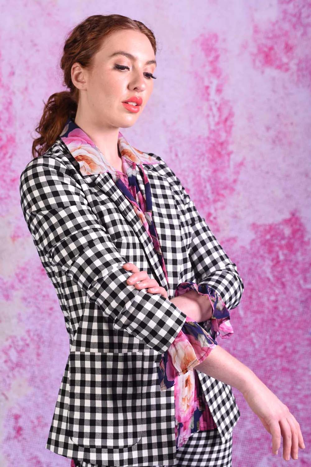 model wearing winn check jacket with posy floral top.
