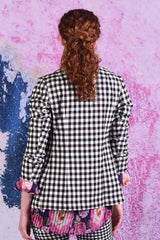 model wearing winn check jacket with posy floral top.