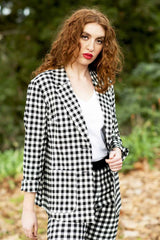model wearing winn check jacket with posy floral top.