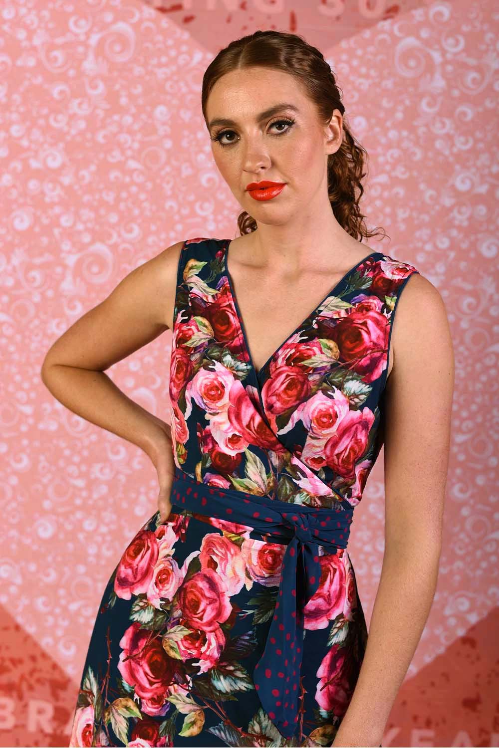 model wearing flipit navy rose dress