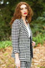 model wearing winn check jacket with posy floral top.