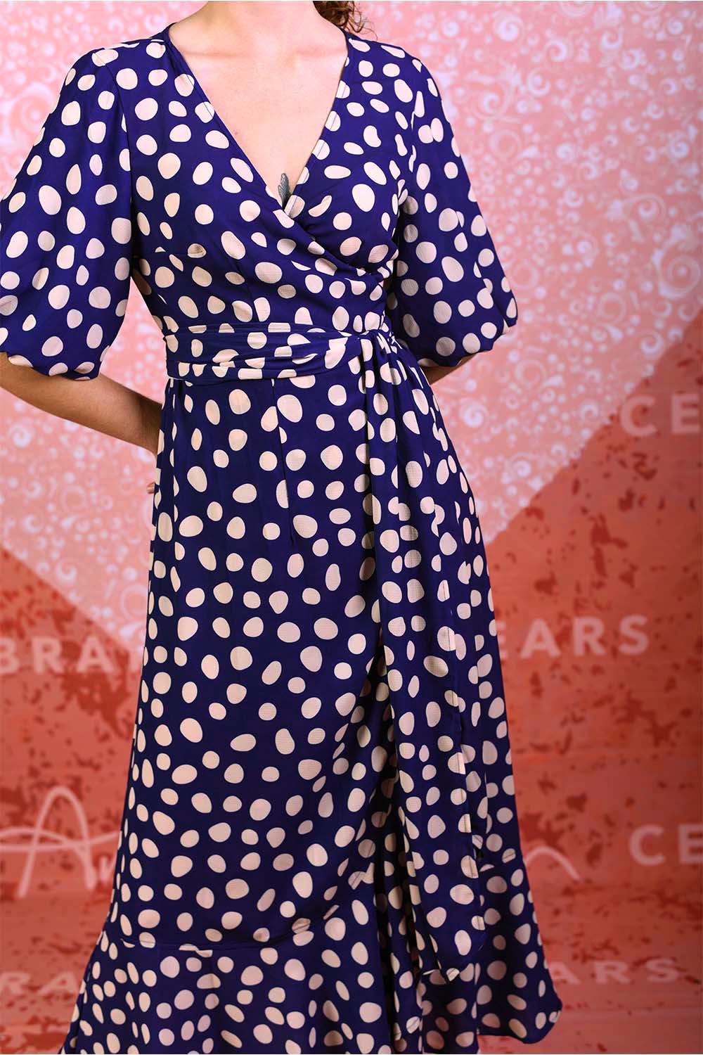 model wearing marshy may navy spot dress