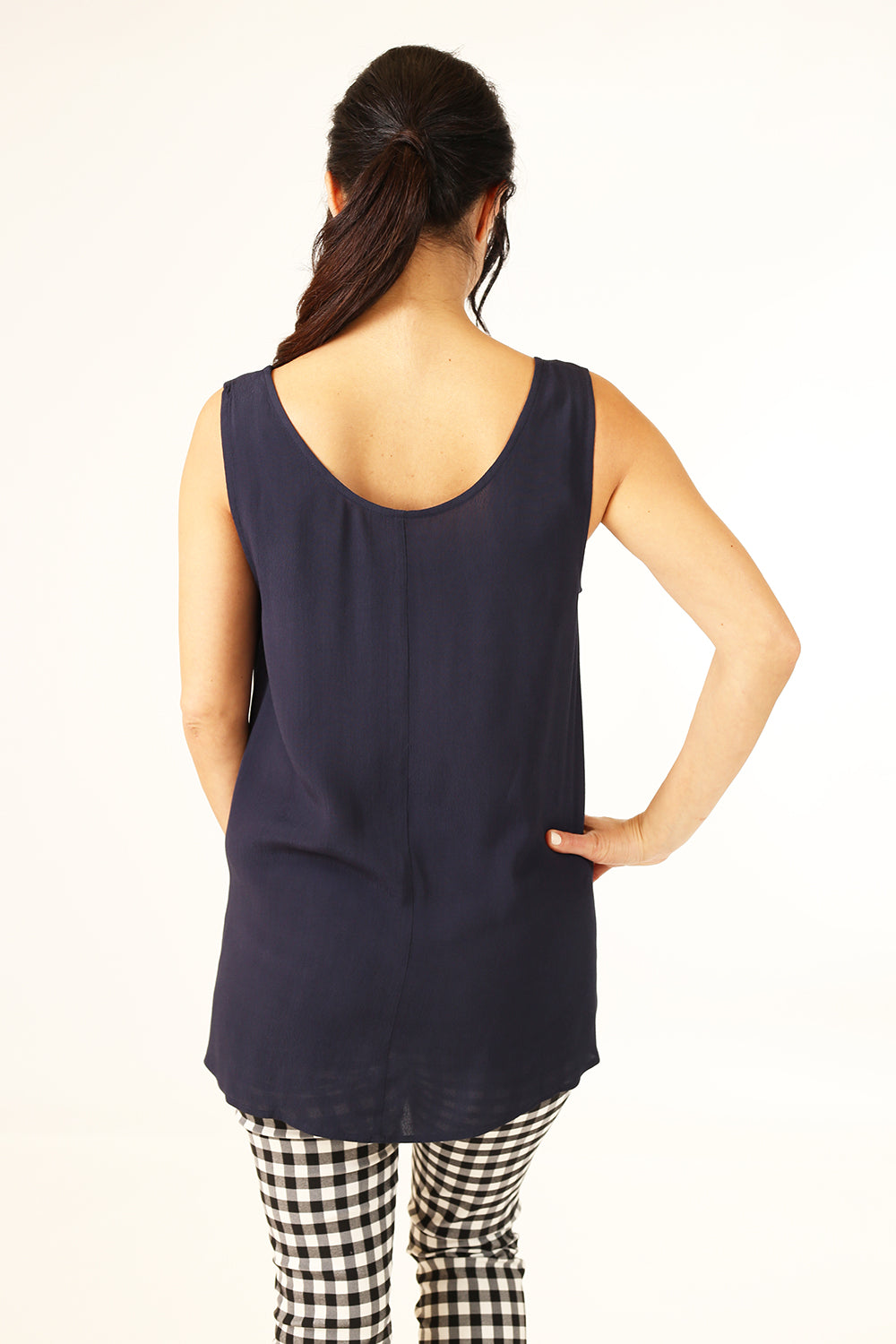 Model wearing Spring Iris tank top in Navy by Annah stretton