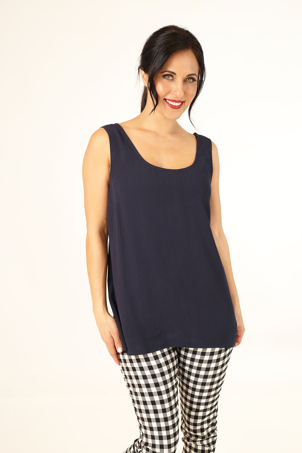 Model wearing Spring Iris tank top in Navy by Annah stretton