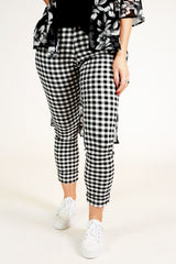Model wearing black and white check pants