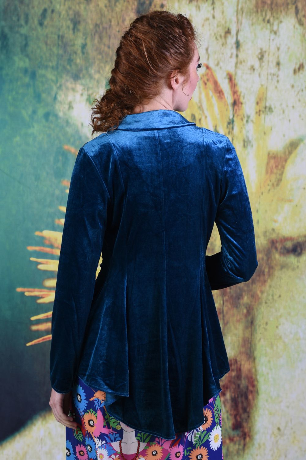 Back of model wearing the Annah Stretton Ady Grace jacket in teal