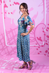 Model wearing alexandrine dress in teal spot print by Annah Stretton