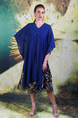Model wearing the Annah Stretton Alison Cape in navy in a loose style
