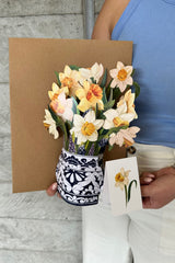Model holding the Annah Stretton Mother's Day flower bouquet in daffodil
