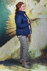 Side of model wearing the navy Ambrosia Puffer Jacket by Annah Stretton