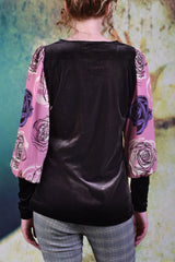 Back of Annah Stretton Astrid top showing a coffee-velvet back with light pink rose sleeves