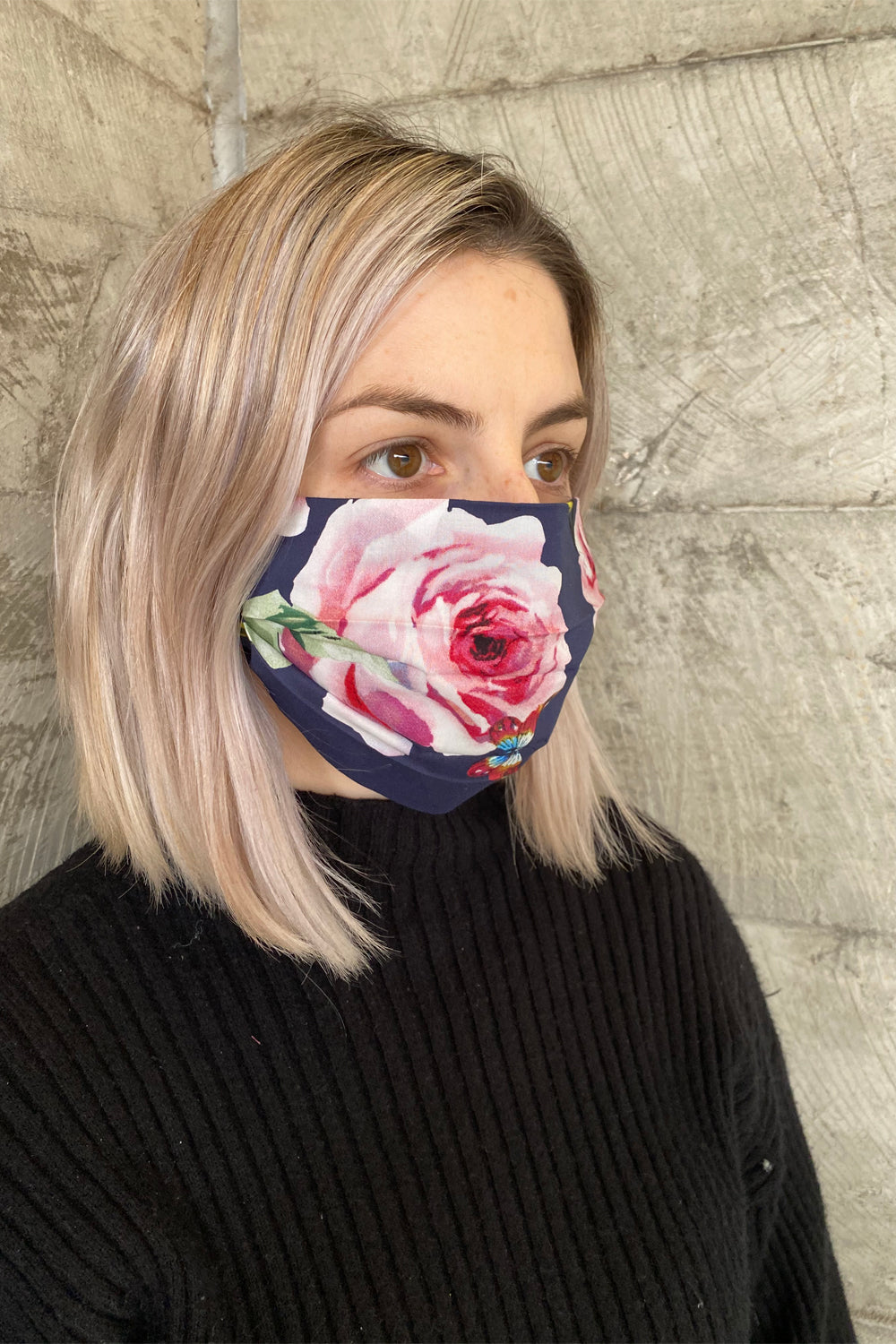 woman wearing annah stretton navy rose cotton face mask