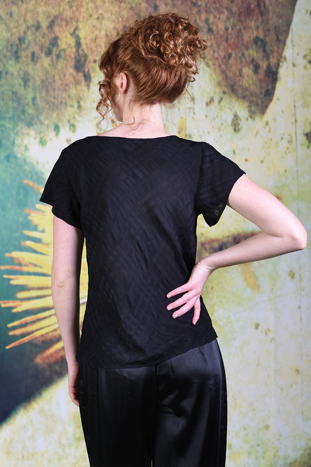 Back of model wearing the Annah Stretton Bijou top in black