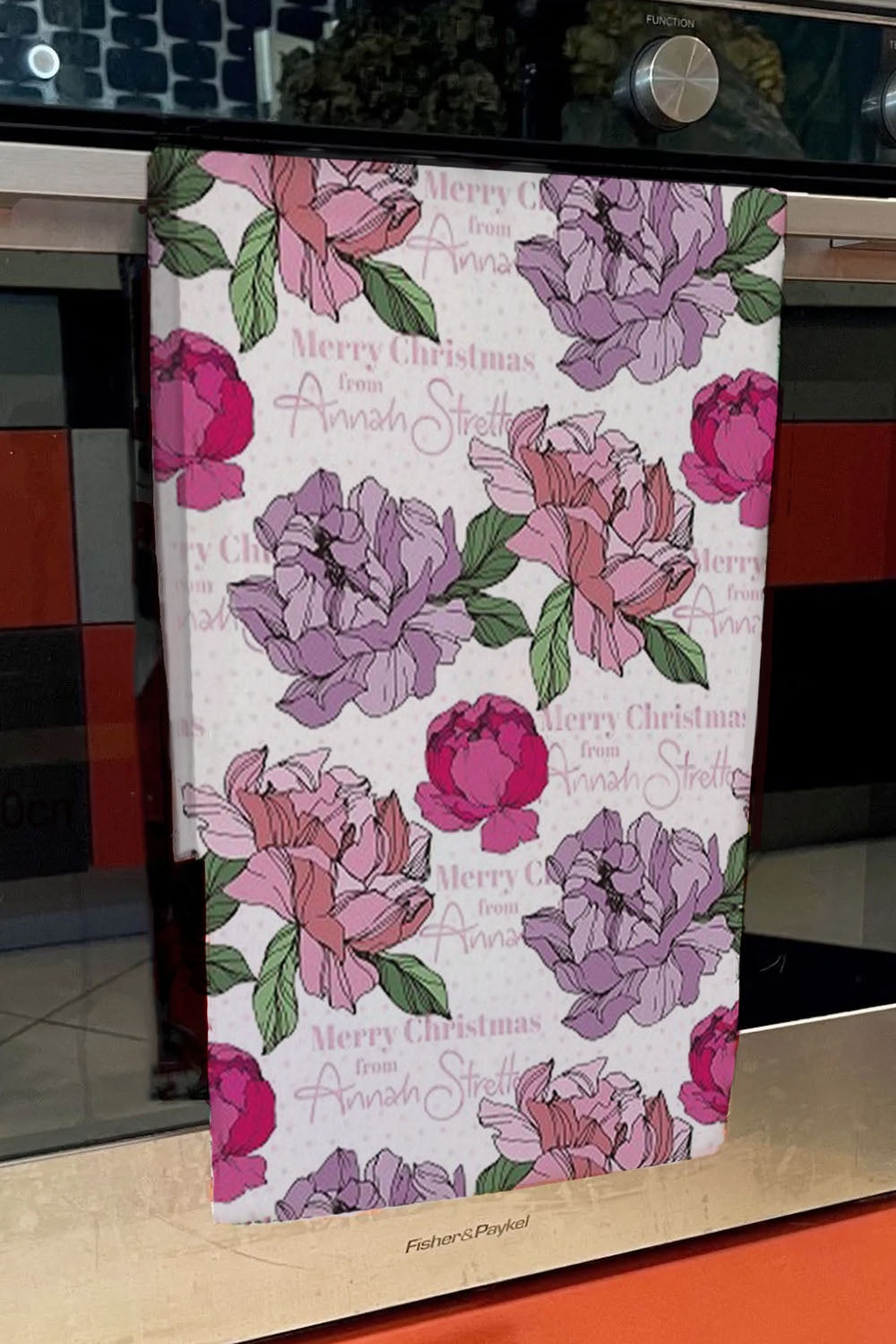 christmas tea towel with floral print by annah stretton