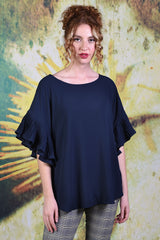 Model wearing the Annah Stretton Dayna top in plain Navy