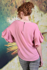 Back of model wearing the Annah Stretton Dayna top in plain pink