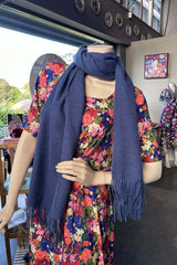 The Annah Stretton Dolly Scarf in light blue on a mannequin