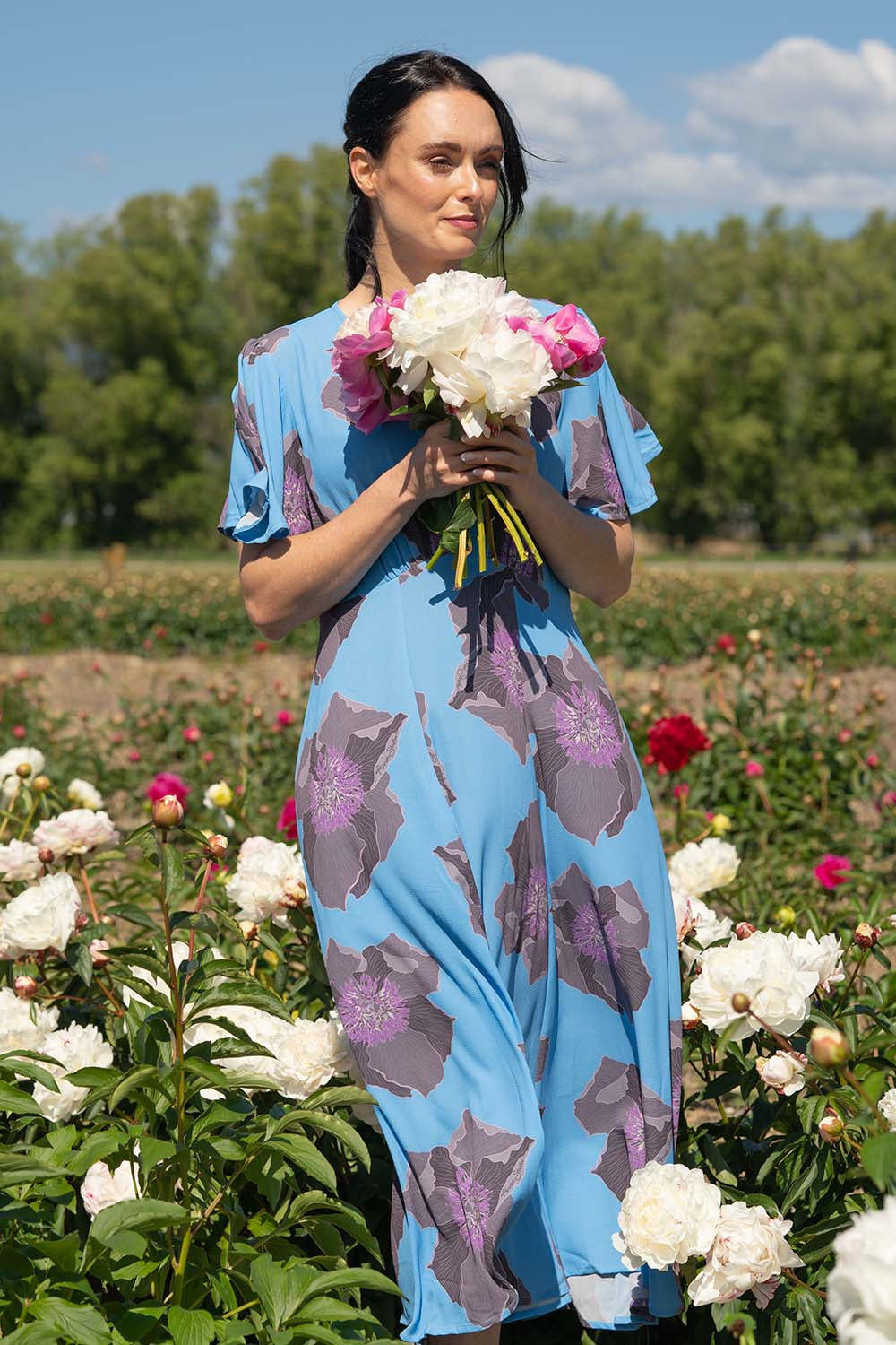 model wearing floral print midi dress by annah stretton