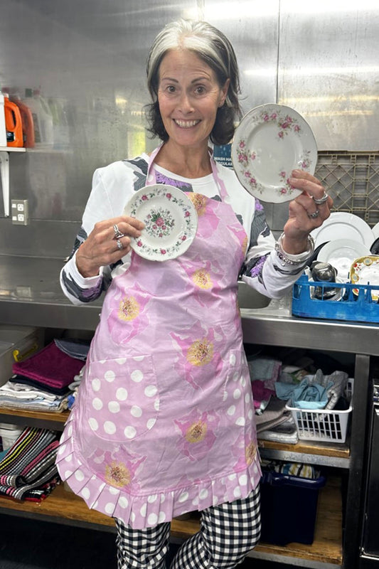 annah stretton wearing ginny jess apron in pink poppy print