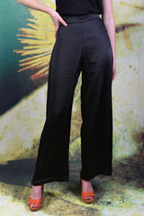 Close-up of model wearing the Annah Stretton Lana Pants in black