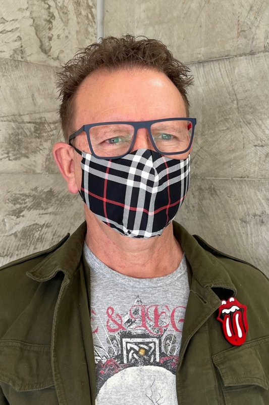 man wearing tartan face mask