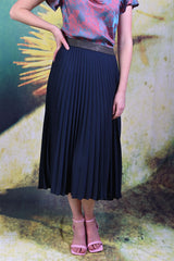 Close-up of model wearing the Annah Stretton Mila Skirt in navy