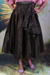 Close-up of Annah Stretton Miriam Max skirt in gold