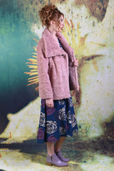 Side of model wearing Annah Stretton's Not Too Fury Jacket in pink