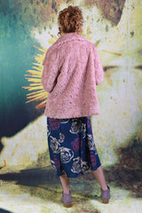 Back of model wearing the Not Too Fury Jacket in pink, by Annah Stretton