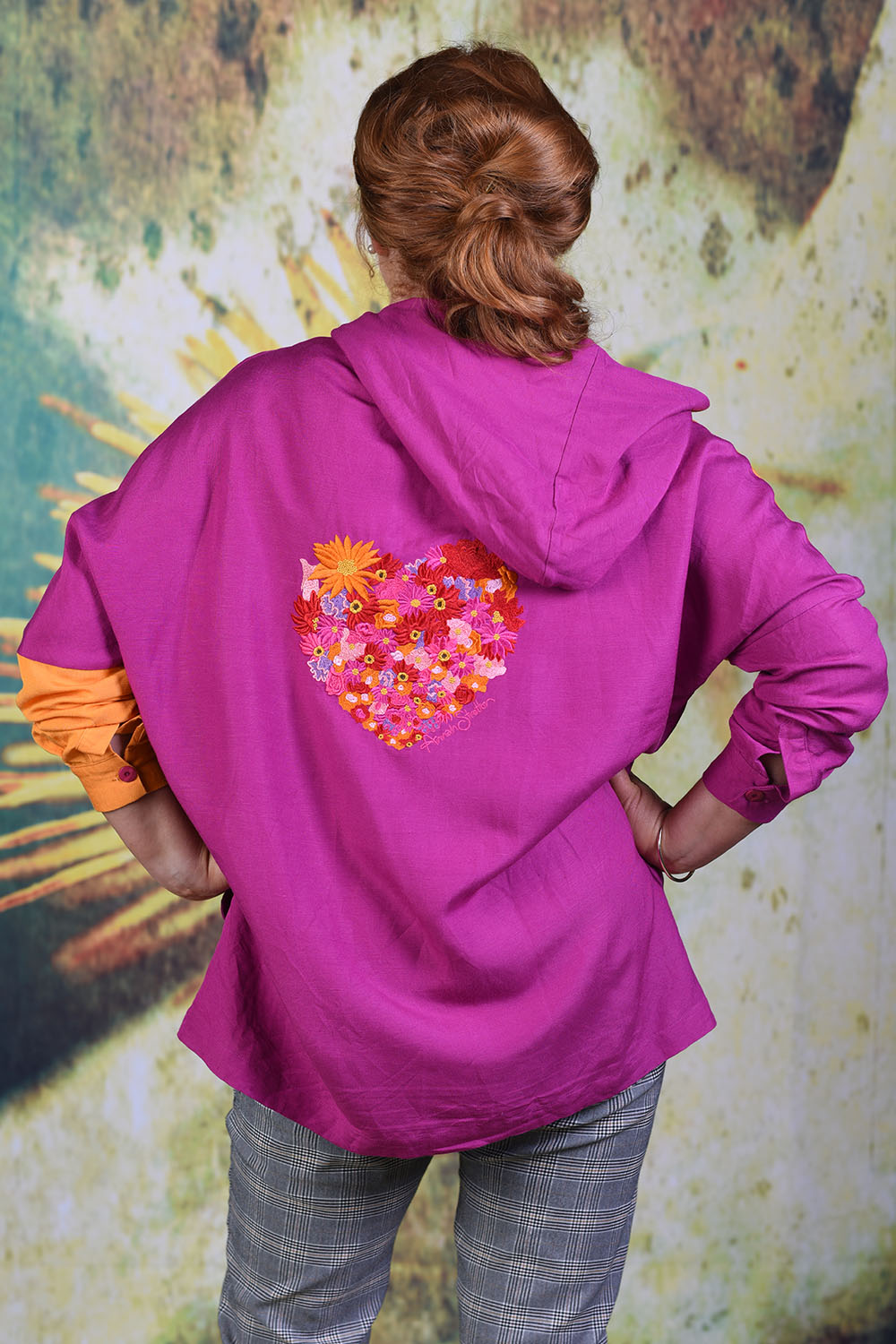 Back of Annah Stretton Periwinkle shirt showing a floral pink and red heart embellishment