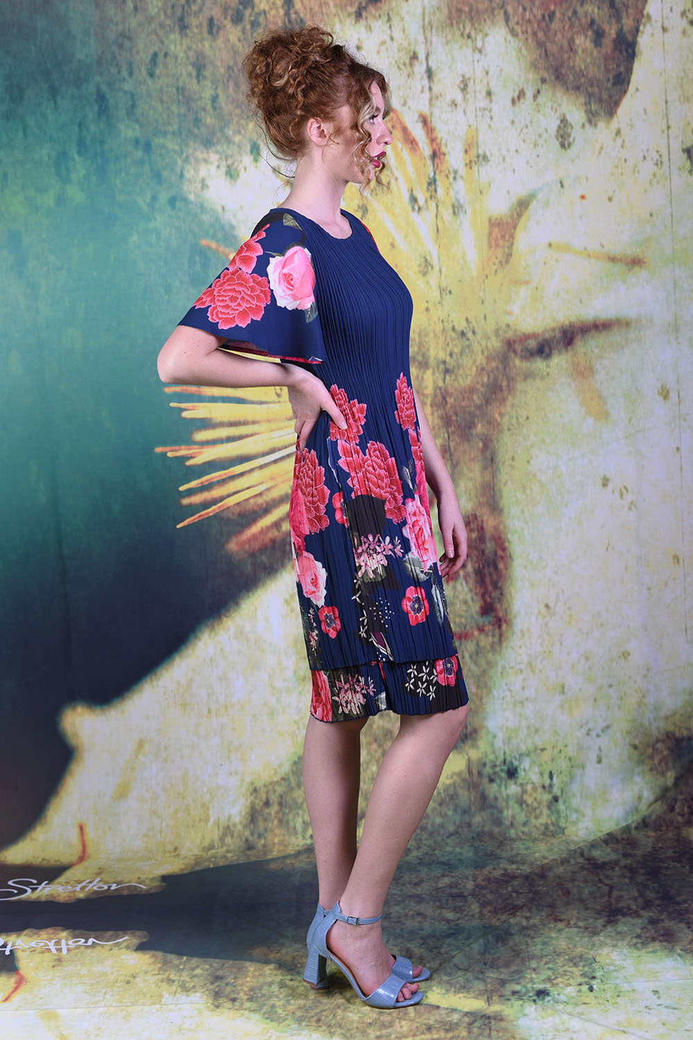Model wearing the Pleat Me Juliet Dress in peony