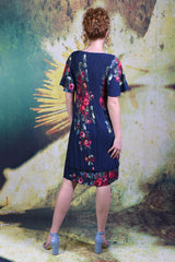 Back of model wearing the Annah Stretton Pleat Me Dress in rose