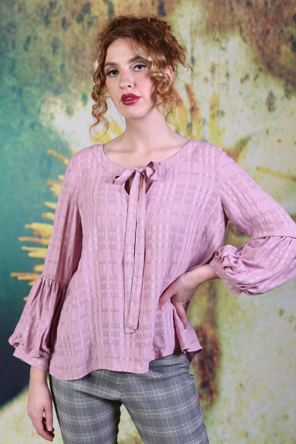 Close-up of model wearing the Annah Stretton Poison Ivy top in Dusky Pink