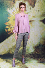 Model wearing the Annah Stretton Poison Ivy top in dusky pink