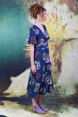 Side of model wearing the Annah Stretton Primrose dress in navy