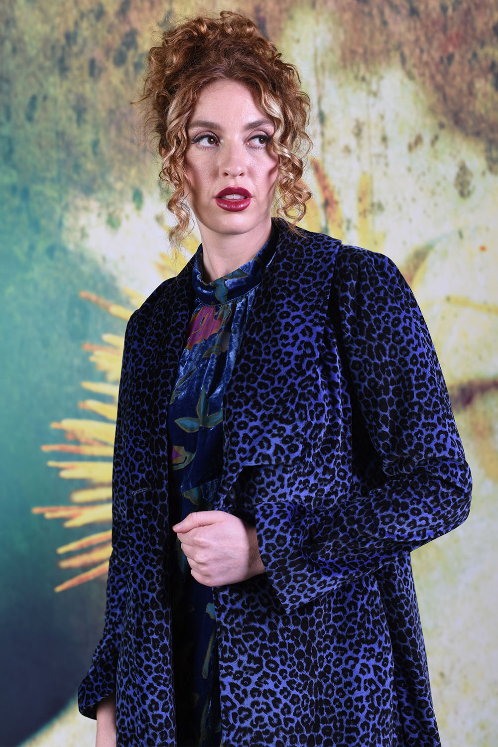 Closer shot of fabric of the Remi Jacket in purple which features a purple leopard print