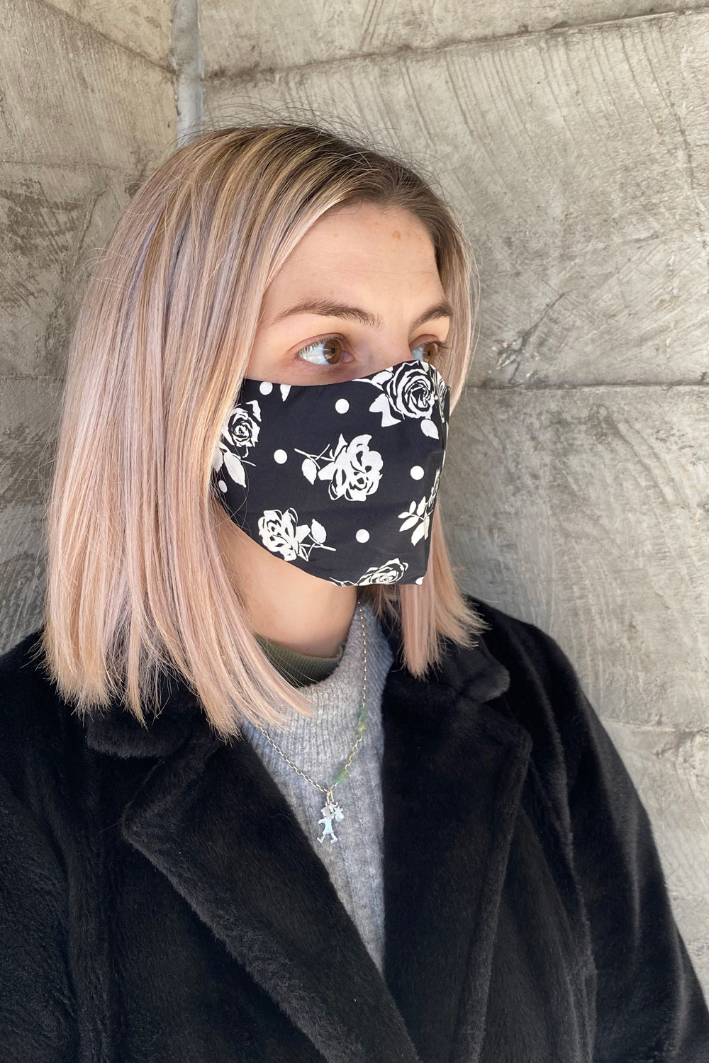 woman wearing rose print face mask