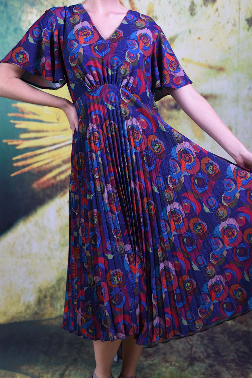 Shot of the flowy fabric of the Annah Stretton Talor dress in mad rose