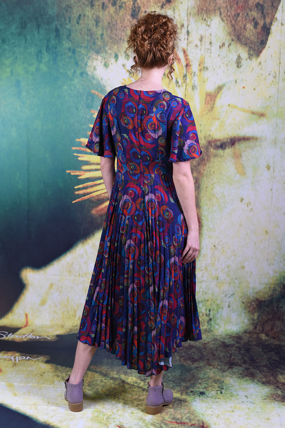 Back of the model wearing the Annah Stretton Talor Dress in mad rose
