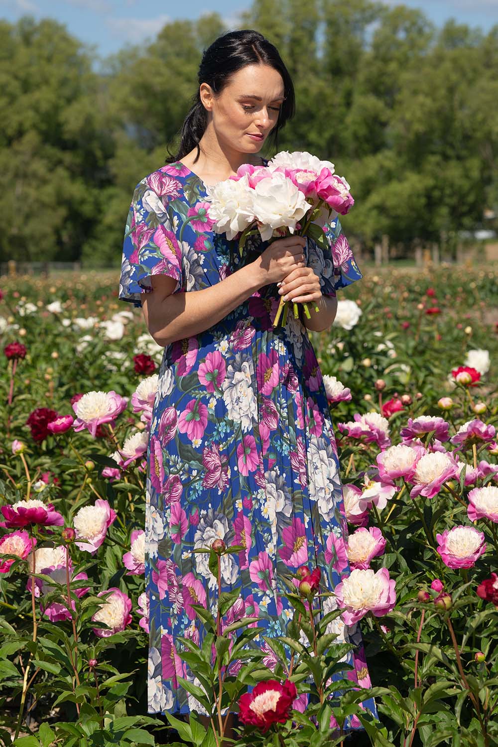 Model wearing Talor vivian dress in navy maria floral print by annah stretton