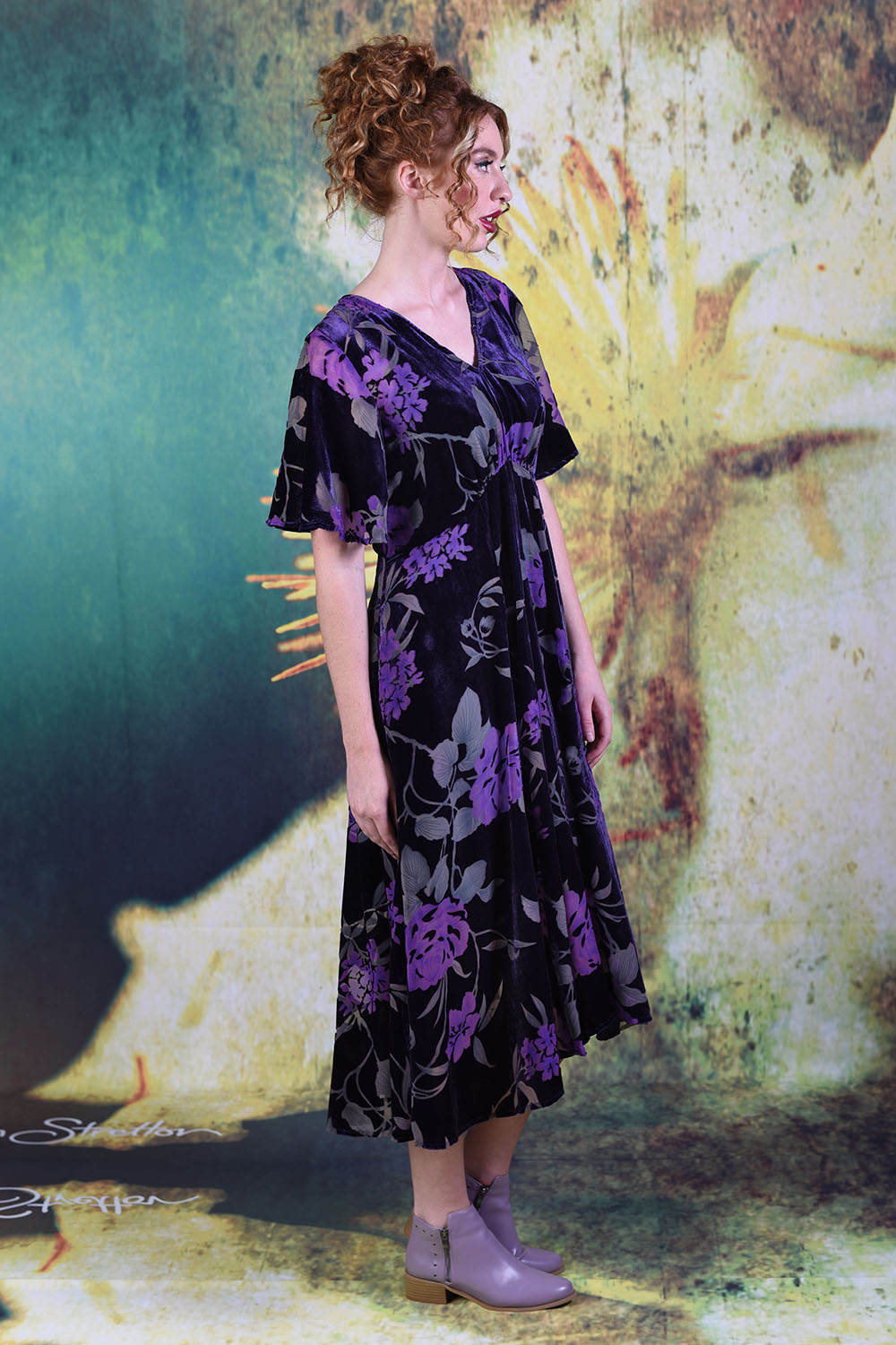 Side of model wearing the Veronica Town Dress in Velvet Purple