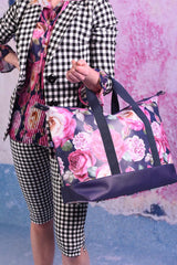 model wearing AS overnight peony bag
