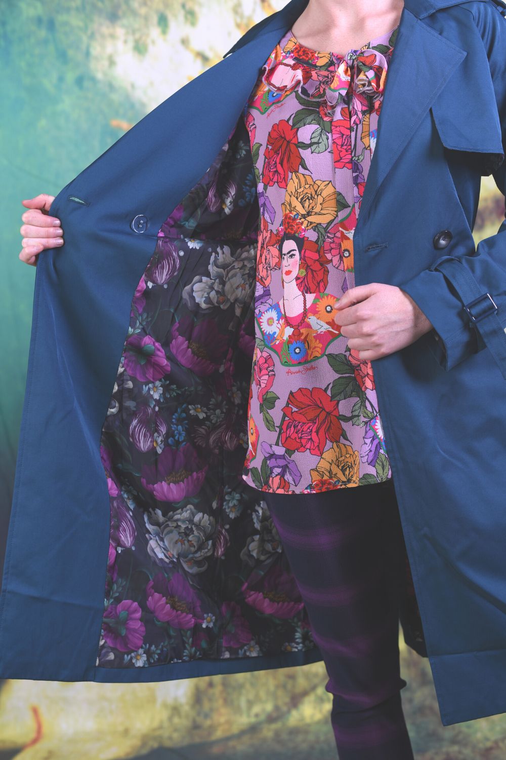 Interior of the Annah Stretton Trench Coat showing a slate background with dark purple and white flowers on top