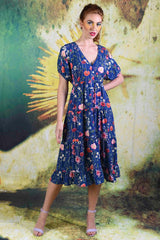 Model wearing the Corsica Magic Navy Garden Party Dress by Annah Stretton