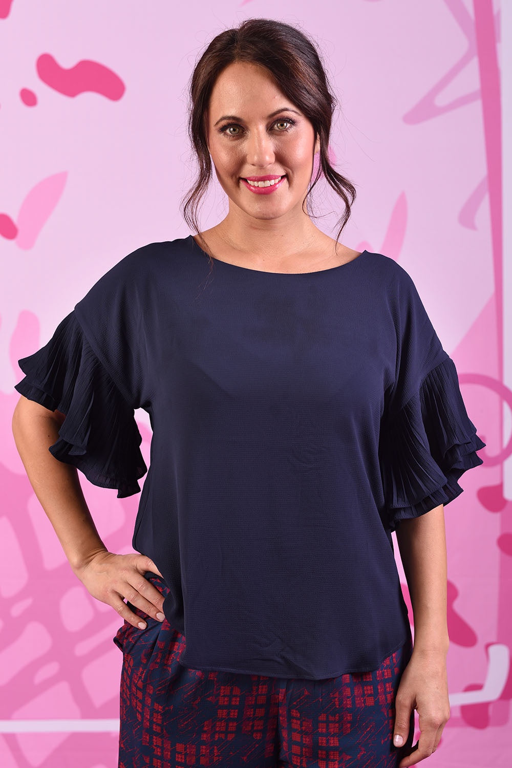 Another model wearing the Dayna Top in plain navy