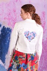 Model wearing white denim jacket with heart embroidered on back - DJ Snowy jacket by Annah Stretton